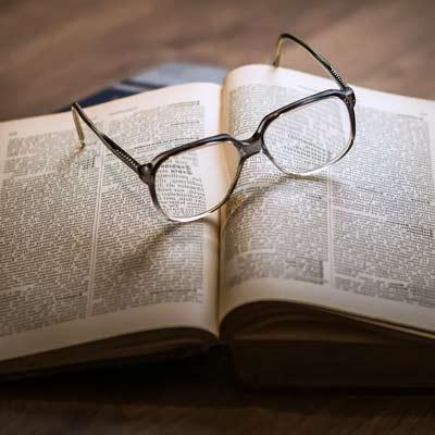 glasses on an open book